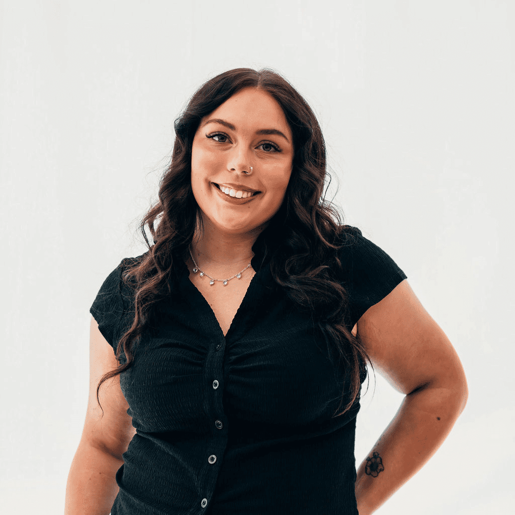 Portrait of Rowan, a professional stylist at Sweet Peach, showcasing their expertise and style.
