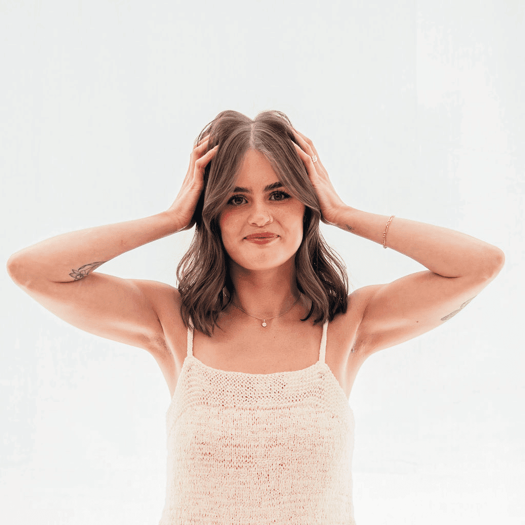 Portrait of Kate, a professional stylist at Sweet Peach, showcasing their expertise and style.